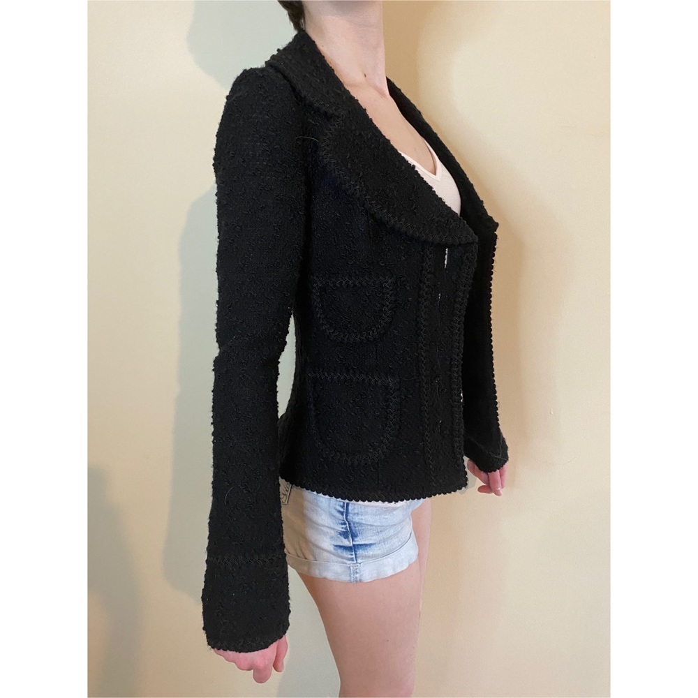 Jacket with rounded lapel and decorative stitching